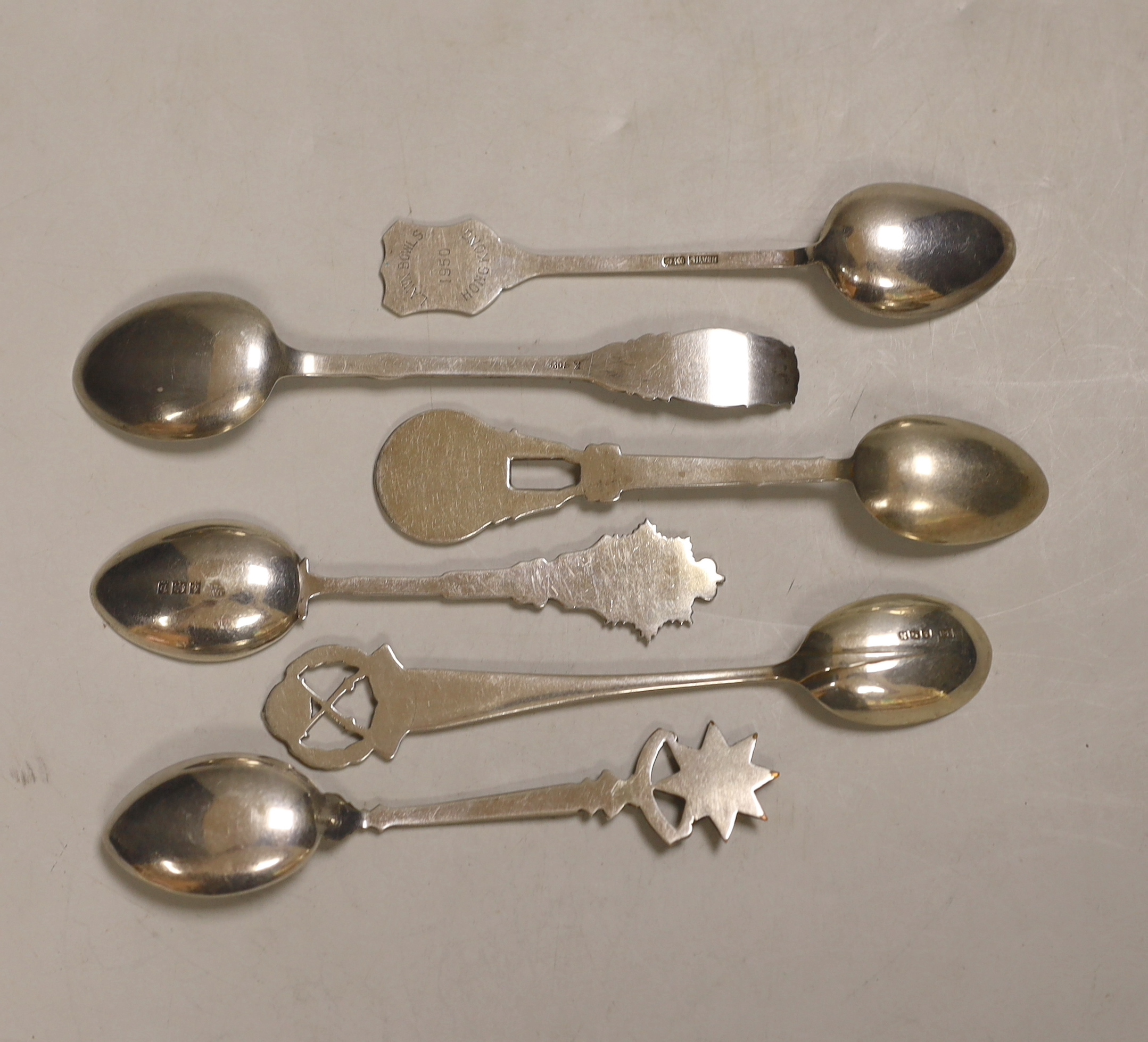 A Roald Amundsen commemorative .830 silver spoon, circa 1911, and five other commemorative spoons, of which four are silver including; Royal Military College, Small Arms School, Royal Army Service Corps, The Kensingtons
